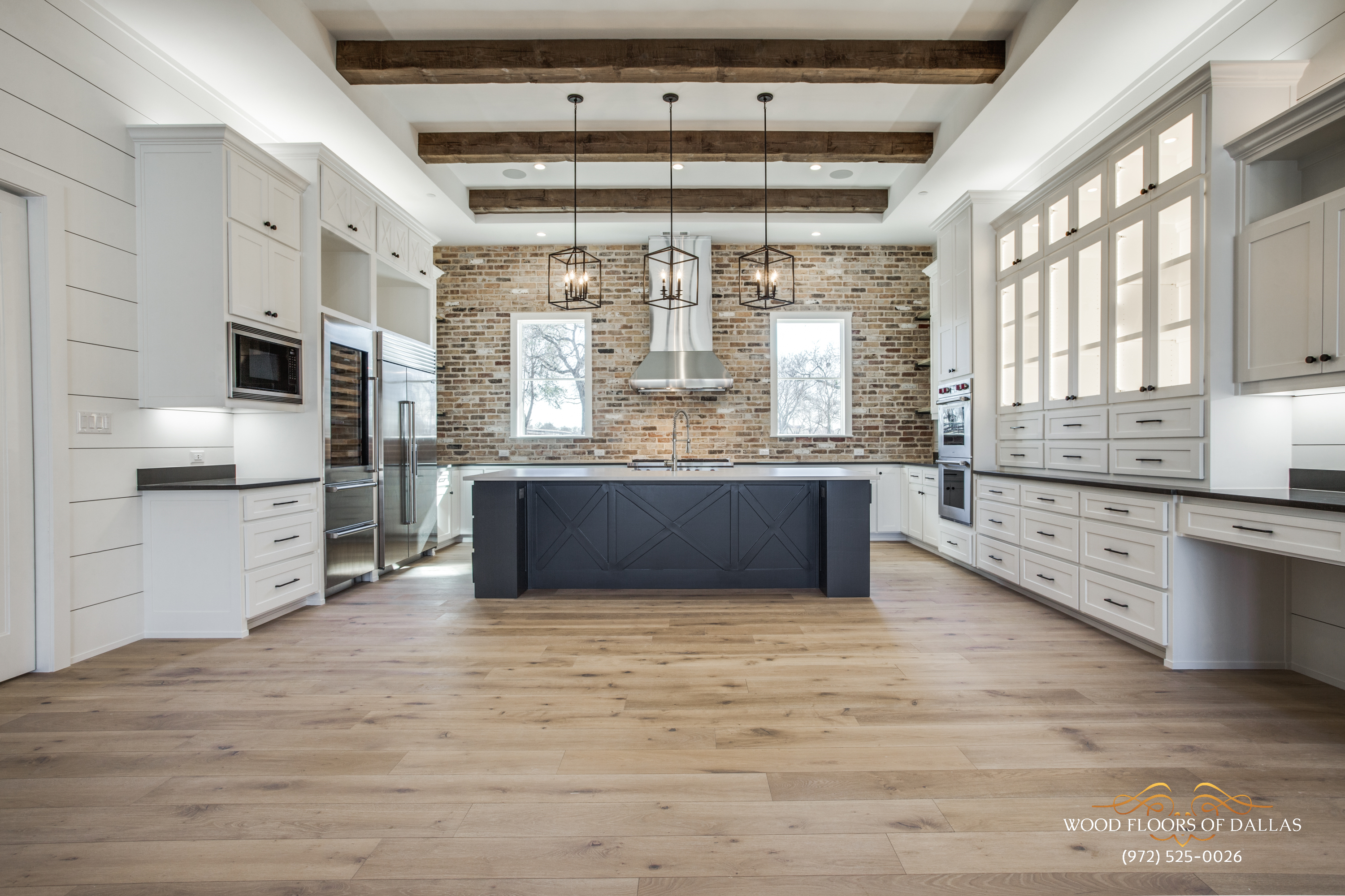 Modern kitchen with hardwood floors installed by Wood Floors of Dallas in Frisco, TX